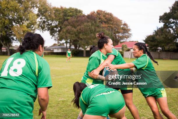 female rugby players tackling in action - grittywomantrend stock pictures, royalty-free photos & images