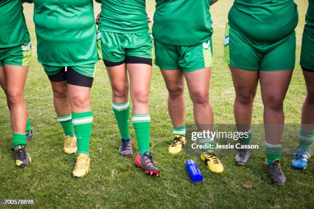 female rugby player standing by pitch, close up of torso, legs and feet - kneesock stock pictures, royalty-free photos & images