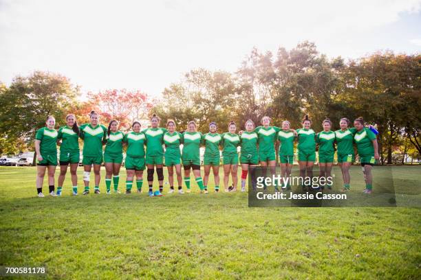 line up of female rugby players on field - line up stock pictures, royalty-free photos & images