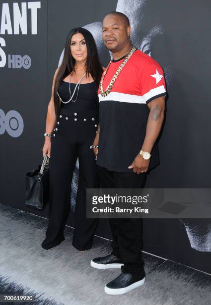 Rapper Xzibit and wife Krista Joiner attend the Premiere of HBO's 'The Defiant Ones' at Paramount Theatre on June 22, 2017 in Hollywood, California.