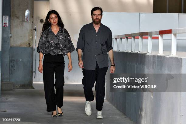 Fashion designers Christophe Lemaire and Sarah-Linh Tran walk the runway during the Lemaire Menswear Spring/Summer 2018 show as part of Paris Fashion...