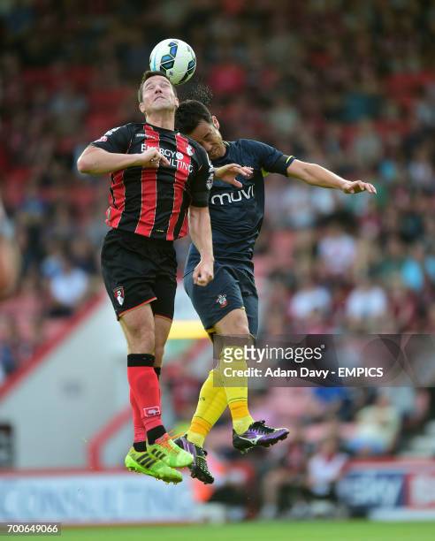 Bournemouth's Yann Kermorgant and Southampton's Maya Yoshida battle for the ball