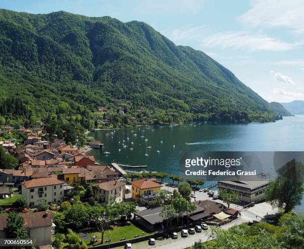 stitched view of caldè on the shores of lake maggiore - lake maggiore stock pictures, royalty-free photos & images