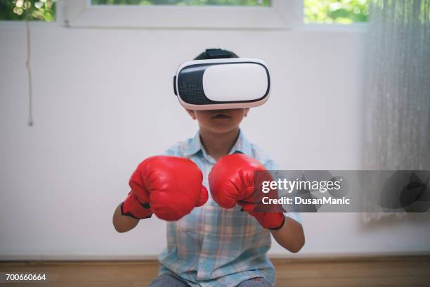 boy in virtual reality glasses playing the game - stills stock pictures, royalty-free photos & images