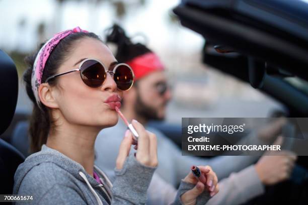 young couple in the car - shiny lips stock pictures, royalty-free photos & images