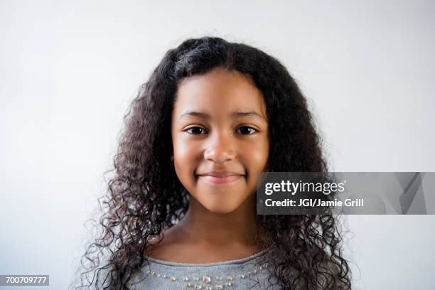 portrait of smiling mixed race girl - girl headshot stock pictures, royalty-free photos & images