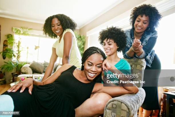 women relaxing in armchair - naturligt hår bildbanksfoton och bilder
