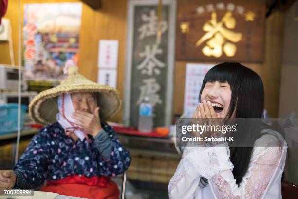 Young woman doing big laugh with senior woman