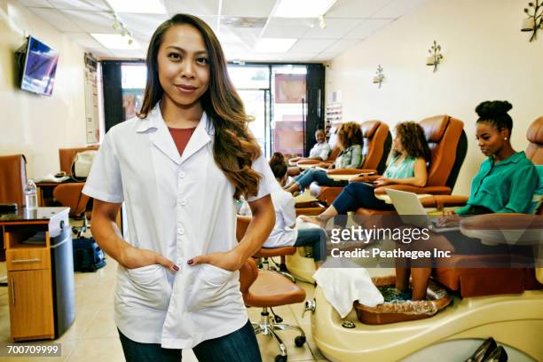 portrait of smiling business owner in nail salon - beautiful filipino women stock pictures, royalty-free photos & images