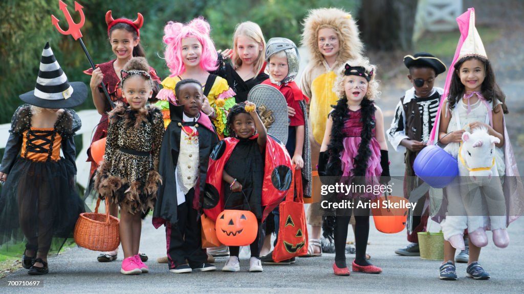 Portrait of children wearing costumes on Halloween