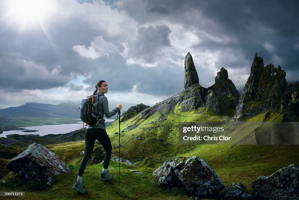 Caucasian woman hiking in rocky landscape