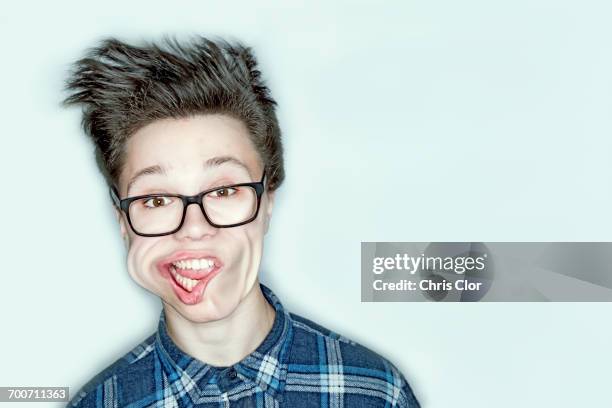 wind blowing face of caucasian teenage boy - wind in face stock pictures, royalty-free photos & images