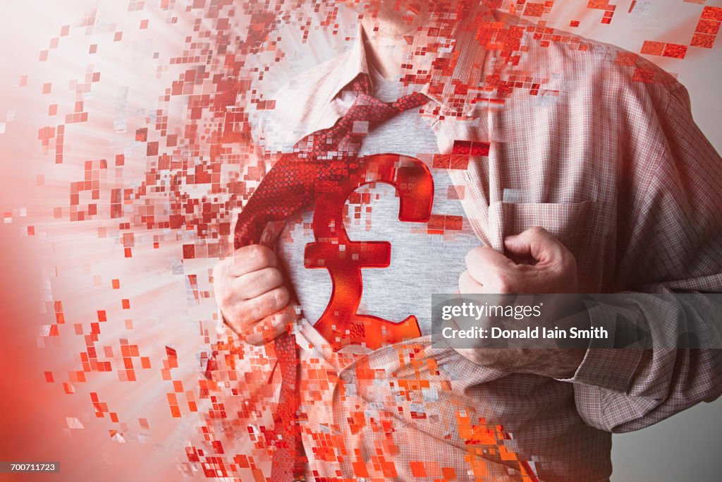 Caucasian businessman opening shirt revealing British pound symbol