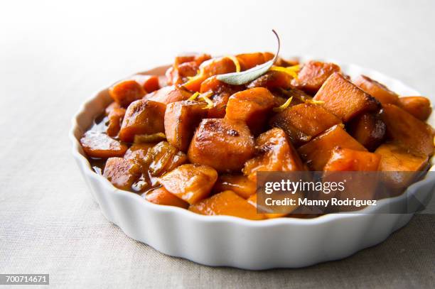 plate of candied yams - yam stock pictures, royalty-free photos & images