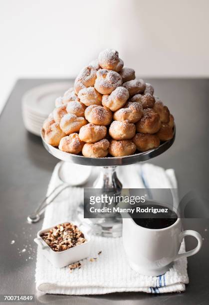 tray of cream puffs - profiterole stock pictures, royalty-free photos & images