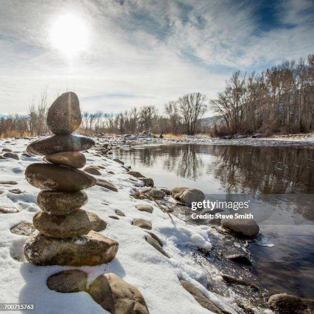 Stacking Riverbed Rocks Stacked River Rock Photos and Premium High Res Pictures - Getty Images