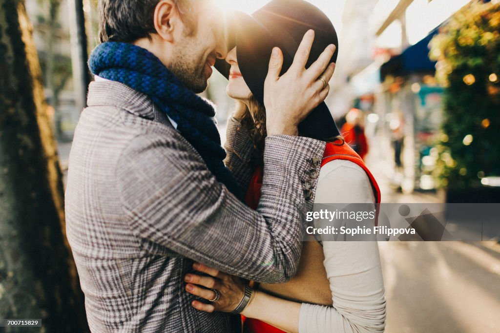 Caucasian couple rubbing noses on sunny day