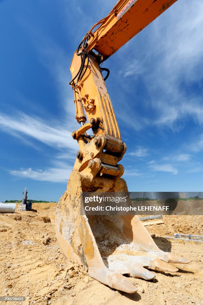 France, Seine-et-Marne. New town of Chessy (Serris-Montevrain-Marne la Vallee). Construction sites (houses, offices). Excavator.