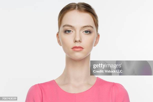 portrait of blonde young woman on white background - hair back stock pictures, royalty-free photos & images