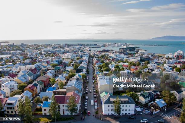 aerial view of reykjavik iceland with ocean in the distance - reykjavik foto e immagini stock