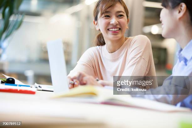women who work in the office - voice search stock pictures, royalty-free photos & images