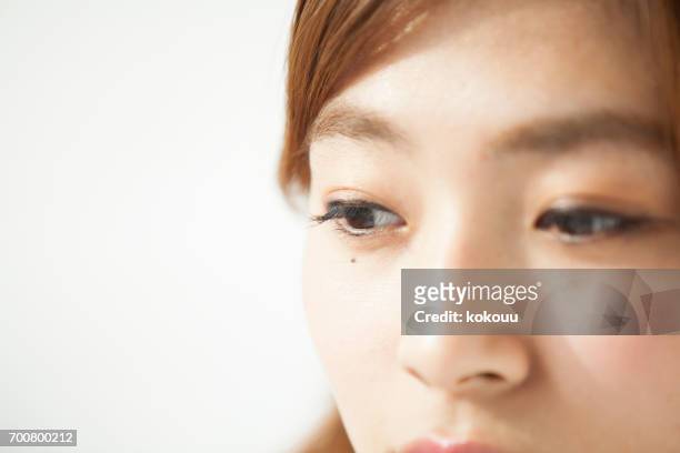 vrouw gezicht close-up - mole stockfoto's en -beelden
