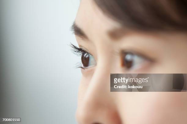 woman's face close up - ear close up stock pictures, royalty-free photos & images