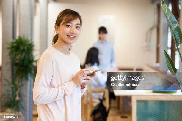 women who work in the office - woman fingers in ears stock pictures, royalty-free photos & images