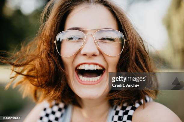 happy girl smiling at the camera - toothy smile stock pictures, royalty-free photos & images