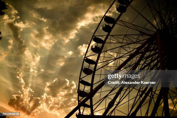 The ferris wheel is seen in the sunset during the Hurricane Festival 2017 on June 22, 2017 in Scheessel, Germany. 75.000 visitors are expected until...