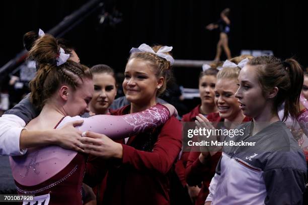 The University of Alabama gymnasts congratulate each other during the Division I Women's Gymnastics Championship is held at Chaifetz Arena on April...