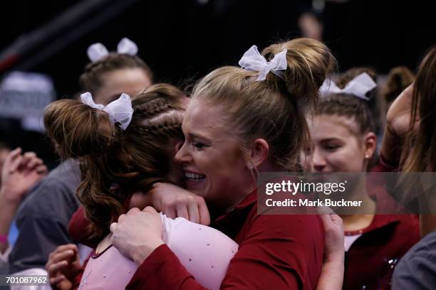 The University of Alabama gymnasts congratulate each other during the Division I Women's Gymnastics Championship is held at Chaifetz Arena on April...