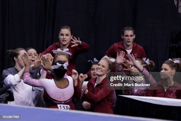 The University of Alabama gymnasts congratulate each other during the Division I Women's Gymnastics Championship is held at Chaifetz Arena on April...