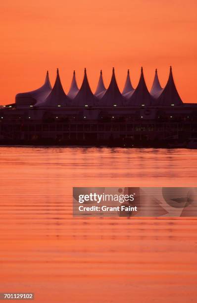 building at sunrise. - canada place stock pictures, royalty-free photos & images