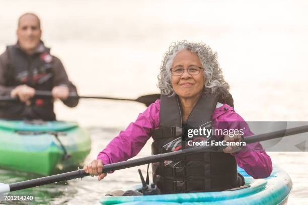 oregon coast kayaking adventure! - asian couple exercise stock pictures, royalty-free photos & images