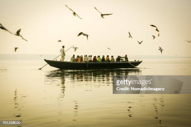 boat trip on the river ganges misty morning atmospherics - varanasi cruise stock pictures, royalty-free photos & images