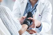 Healthcare professional places brace on patient's arm