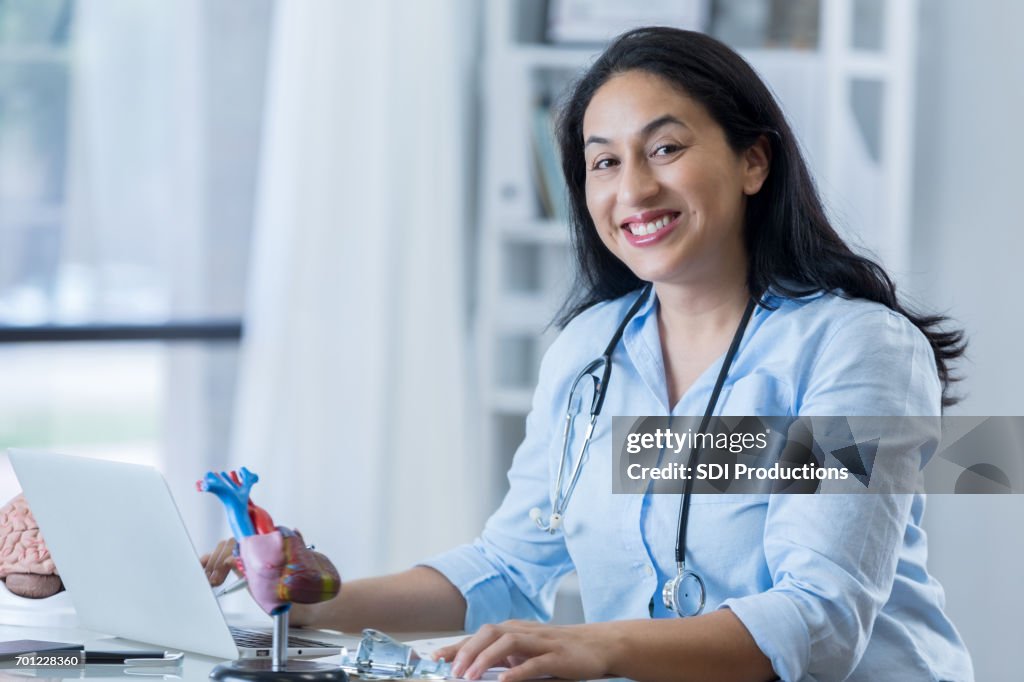 Confident female cardiologist at work