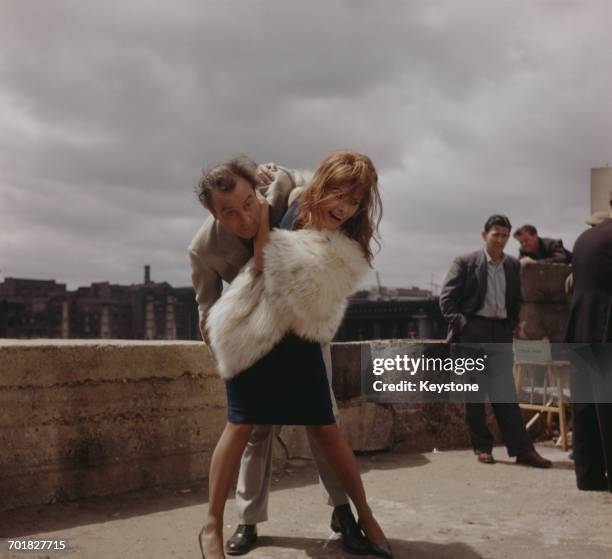 Italian actress Sophia Loren and English actor Dennis Price rehearse the scene for the film 'The Millionairess' in which she throws his character...