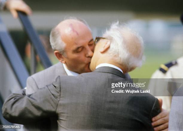Chairman of the State Council of the German Democratic Republic, Erich Honecker, welcomes Soviet leader Mikhail Gorbachev to the Warsaw Pact summit...