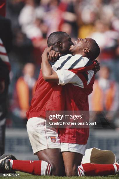 Arsenal footballers Ian Wright and Kevin Campbell embrace and celebrate as Arsenal beat Tottenham Hotspur 1-0 in their FA Cup semi final match at...