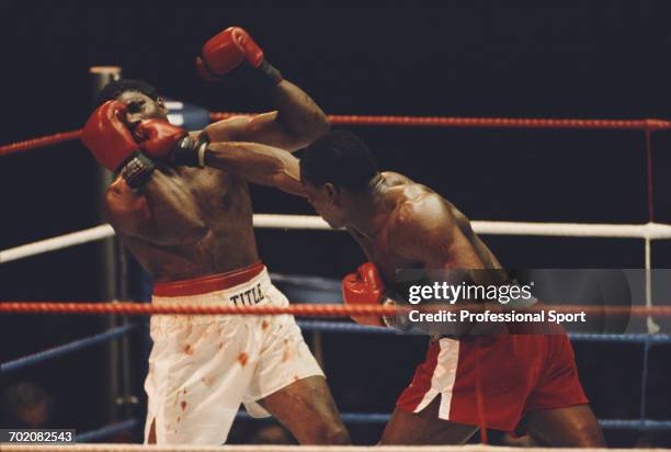 British heavyweight boxer Frank Bruno lands a punch to the jaw of American boxer James Tillis during their heavyweight fight at Wembley Arena in...