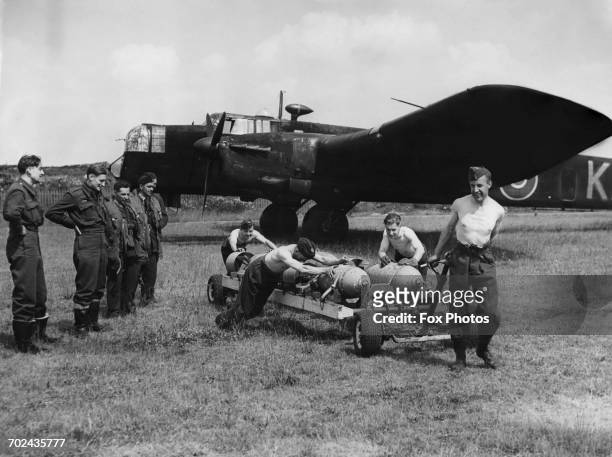 The crew of an Armstrong Whitworth Whitley MkV twin-engine heavy bomber UO-KA of No.19 Operational Training Unit Squadron Royal Air Force Bomber...