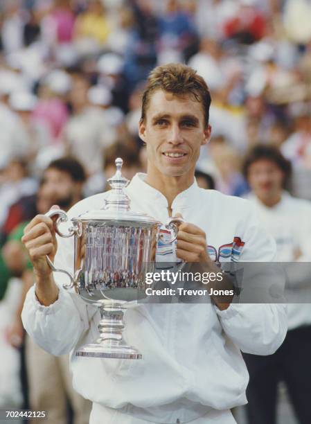 Ivan Lendl of Czechoslovakia holds the trophy after defeating compatriot Miloslav Mečíř during their Men's Singles Final match at the 1986 United...