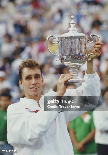Ivan Lendl of Czechoslovakia holds the trophy after defeating compatriot Miloslav Mečíř during their Men's Singles Final match at the 1986 United...