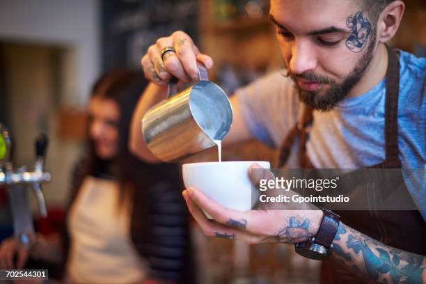 barista making coffee - barista coffee milk stock pictures, royalty-free photos & images