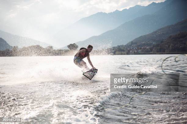 waterskier waterskiing, maggiore lake, verbania, piedmont, italy - lago maggiore foto e immagini stock