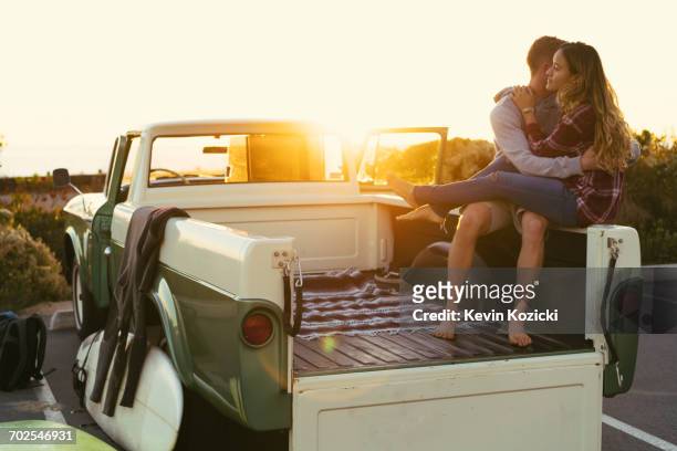 surfing couple in back of pickup truck at newport beach, california, usa - pick up truck back stock pictures, royalty-free photos & images