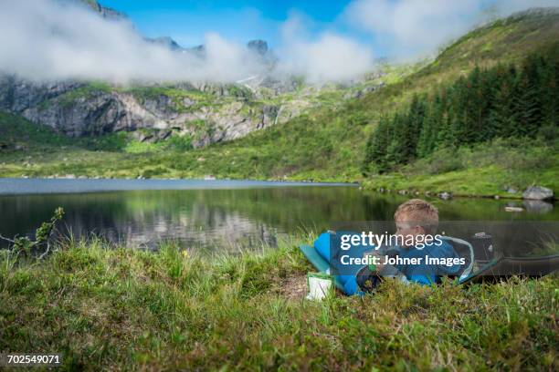 boy having a drink at lake - kids hiking stock pictures, royalty-free photos & images