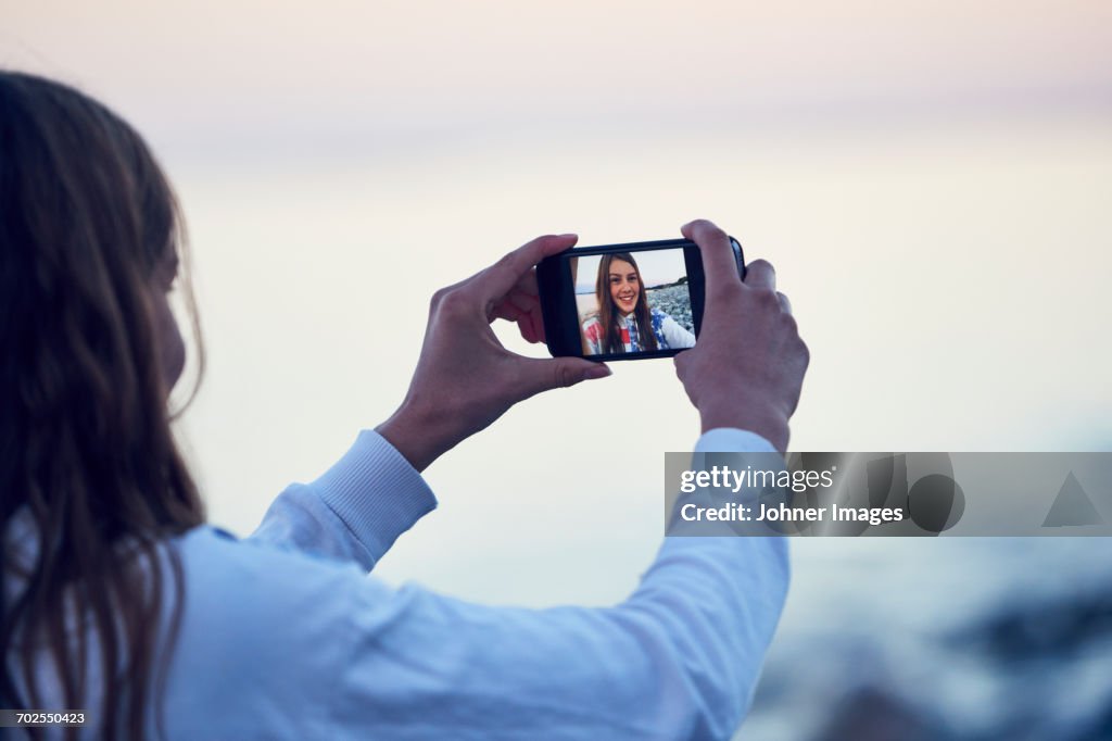 Teenage girl taking selfie